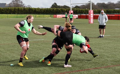 210323 - Wales Women Rugby Training Session -Georgia Evans is tackled by Abbie Fleming during a training session ahead of Wales’ opening Women’s 6 Nations match against Ireland