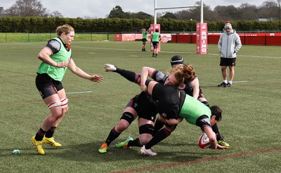 210323 - Wales Women Rugby Training Session -Georgia Evans is tackled by Abbie Fleming during a training session ahead of Wales’ opening Women’s 6 Nations match against Ireland