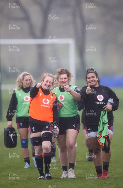 210323 - Wales Women Rugby Training Session - Abbie Fleming, Gwenllian Pyrs and Sisilia Tuipulotu walk down to a training session ahead of Wales’ opening Women’s 6 Nations match against Ireland