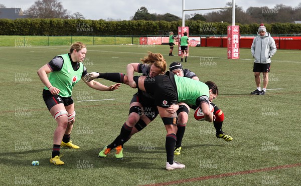 210323 - Wales Women Rugby Training Session -Georgia Evans is tackled by Abbie Fleming during a training session ahead of Wales’ opening Women’s 6 Nations match against Ireland