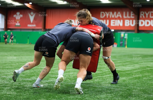 220425 - Wales Women Rugby Training - Natalia John, Keira Bevan and Courtney Keight of Wales during training session ahead of Wales’ final Guinness Women’s Six Nations match against Italy