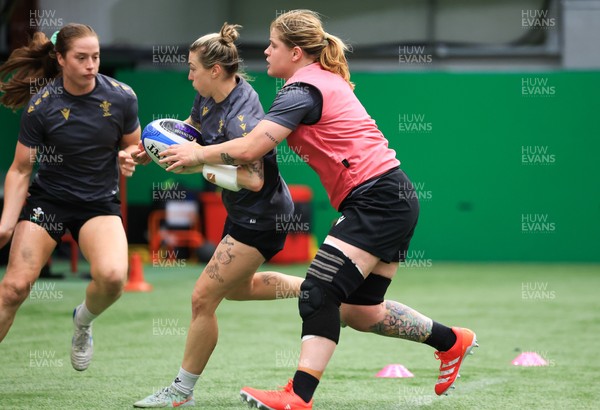 220425 - Wales Women Rugby Training - Keira Bevan of Wales and Bethan Lewis of Wales during training session ahead of Wales’ final Guinness Women’s Six Nations match against Italy