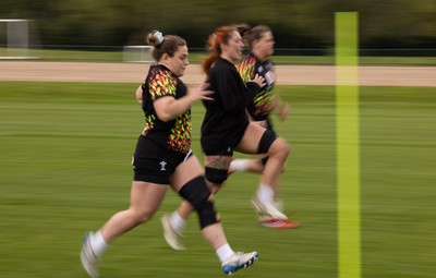 210426 - Wales Women’s Rugby Training - Jenni Scoble, Georgia Evans and Natalia John during a rugby training session ahead of the Women’s 6 Nation’s match against England