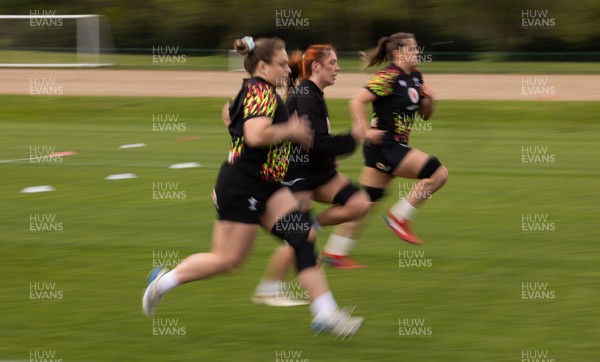 210426 - Wales Women’s Rugby Training - Jenni Scoble, Georgia Evans and Natalia John during a rugby training session ahead of the Women’s 6 Nation’s match against England