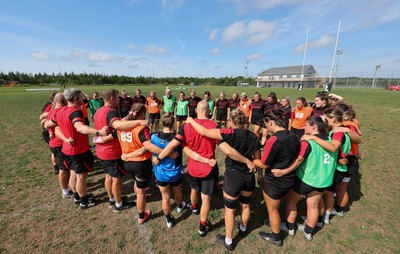 220822 - Wales Women Rugby in Canada - The Wales Women Huddle together at the end of their first training session at their training base just outside Halifax