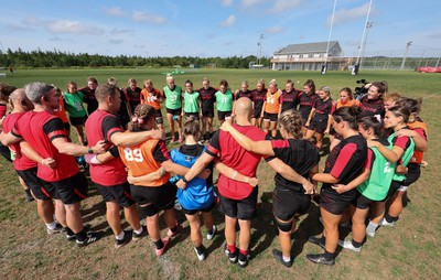 220822 - Wales Women Rugby in Canada - The Wales Women Huddle together at the end of their first training session at their training base just outside Halifax