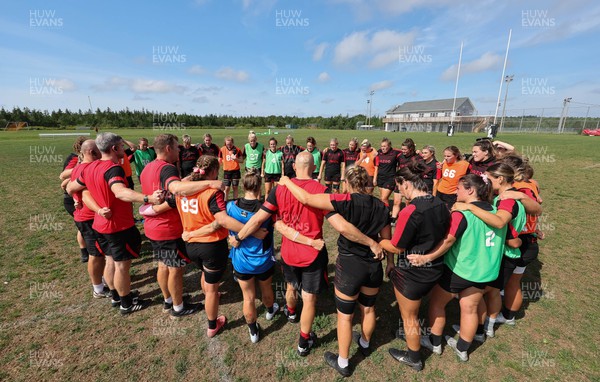 220822 - Wales Women Rugby in Canada - The Wales Women Huddle together at the end of their first training session at their training base just outside Halifax