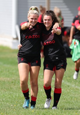 230822 - Wales Women Rugby Training Session - Alex Callender and Eloise Hayward make their way out to training