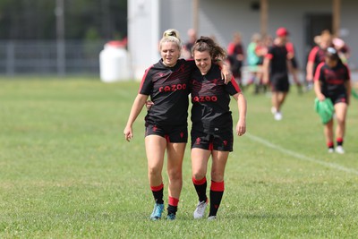 230822 - Wales Women Rugby Training Session - Alex Callender and Eloise Hayward make their way out to training