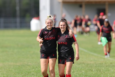 230822 - Wales Women Rugby Training Session - Alex Callender and Eloise Hayward make their way out to training