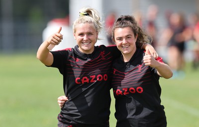 230822 - Wales Women Rugby Training Session - Alex Callender and Eloise Hayward make their way out to training