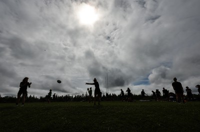 230822 - Wales Women rugby squad players warm up during a training session against the Canadian Women’s rugby squad near Halifax