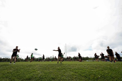 230822 - Wales Women rugby squad players warm up during a training session against the Canadian Women’s rugby squad near Halifax