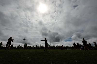 230822 - Wales Women rugby squad players warm up during a training session against the Canadian Women’s rugby squad near Halifax