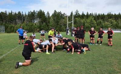 230822 - Wales Women Rugby Training Session - Players and management look on as Wales and Canada train against each other ahead of their match this weekend