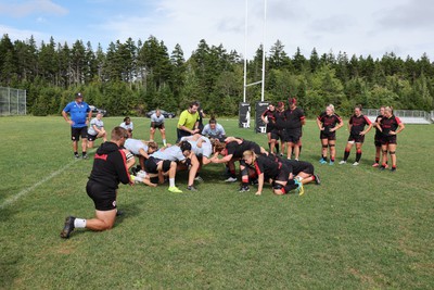 230822 - Wales Women Rugby Training Session - Players and management look on as Wales and Canada train against each other ahead of their match this weekend