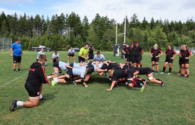 230822 - Wales Women Rugby Training Session - Players and management look on as Wales and Canada train against each other ahead of their match this weekend