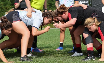 230822 - Wales Women Rugby Training Session - Players and management look on as Wales and Canada train against each other ahead of their match this weekend