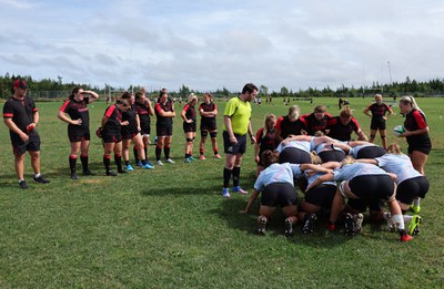 230822 - Wales Women Rugby Training Session - Players and management look on as Wales and Canada train against each other ahead of their match this weekend