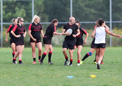 230822 - Wales Women Rugby Training Session - Players and management look on as Wales and Canada train against each other ahead of their match this weekend