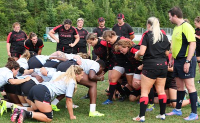 230822 - Wales Women Rugby Training Session - Players and management look on as Wales and Canada train against each other ahead of their match this weekend