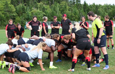 230822 - Wales Women Rugby Training Session - Players and management look on as Wales and Canada train against each other ahead of their match this weekend