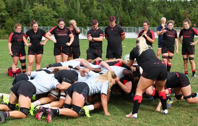 230822 - Wales Women Rugby Training Session - Players and management look on as Wales and Canada train against each other ahead of their match this weekend