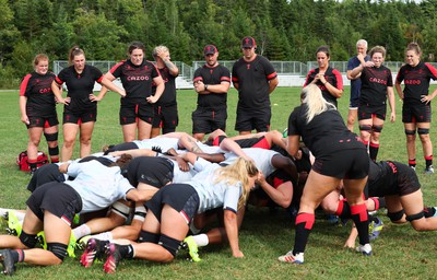 230822 - Wales Women Rugby Training Session - Players and management look on as Wales and Canada train against each other ahead of their match this weekend