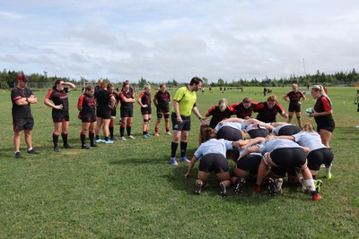 230822 - Wales Women Rugby Training Session - Players and management look on as Wales and Canada train against each other ahead of their match this weekend