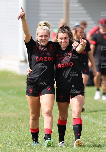 230822 - Wales Women Rugby Training Session - Alex Callender and Eloise Hayward make their way out to training