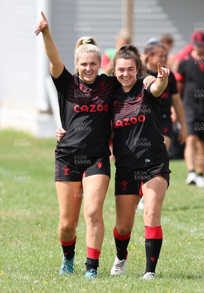 230822 - Wales Women Rugby Training Session - Alex Callender and Eloise Hayward make their way out to training