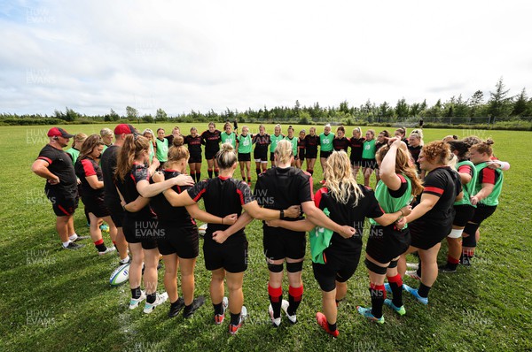 230822 - Wales Women rugby squad players warm up during a training session against the Canadian Women’s rugby squad near Halifax