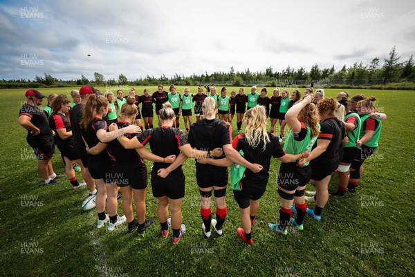 230822 - Wales Women rugby squad players warm up during a training session against the Canadian Women’s rugby squad near Halifax