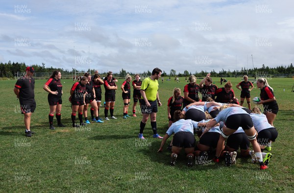 230822 - Wales Women Rugby Training Session - Players and management look on as Wales and Canada train against each other ahead of their match this weekend