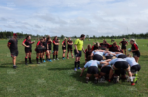 230822 - Wales Women Rugby Training Session - Players and management look on as Wales and Canada train against each other ahead of their match this weekend