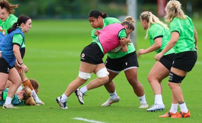230926 Wales Women Rugby Training Session - Alisha Joyce takes on Sisilia Tuipulotu during a training session ahead of the WXV match against the USA