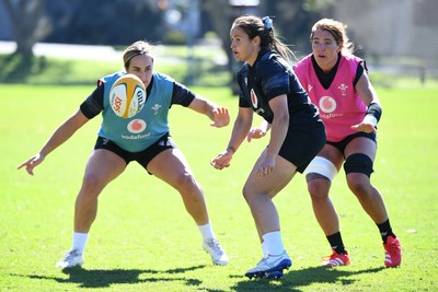 240725 - Wales Women Rugby Training at The Southport School, Southport - Courtney Keight, Kayleigh Powell and Georgia Evans during a Wales Womens Rugby training session ahead of their first tour match against Australia
