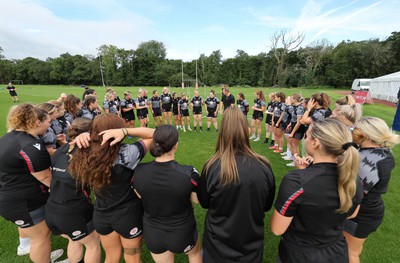 240823 - Wales Women Training session - The team huddle together during training session