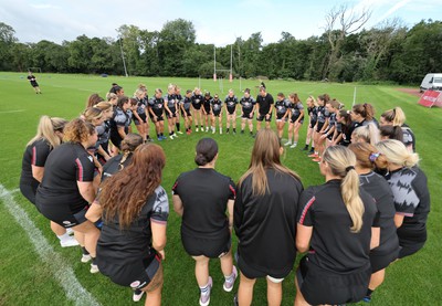 240823 - Wales Women Training session - The team huddle together during training session