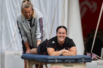 240823 - Wales Women Training session - Ffion Lewis receives treatment from Jo Perkins during training session