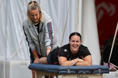 240823 - Wales Women Training session - Ffion Lewis receives treatment from Jo Perkins during training session