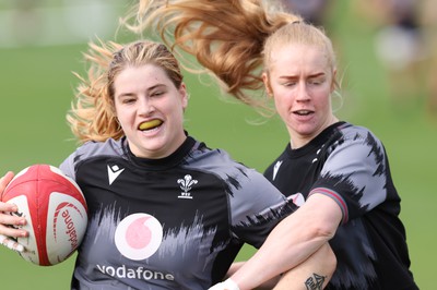 240823 - Wales Women Training session - Bethan Lewis is tackled by Cath Richards during training session