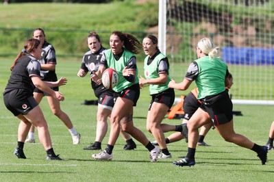 240823 - Wales Women Training session - Georgia Evans feeds the ball out during training session