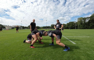 240823 - Wales Women Training session - Cana Williams and Donna Rose go through a session as Mike Hill looks on