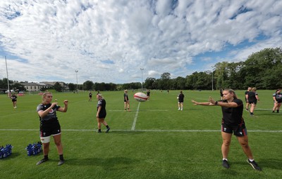 240823 - Wales Women Training session - Bryonie King, left and Amelia Tutt work together at the end of the session