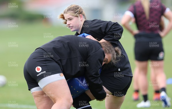 241023 - Wales Women Rugby Training Session - Bethan Lewis takes on Carys Phillips during a training session ahead of their WXV1 match against New Zealand in Dunedin