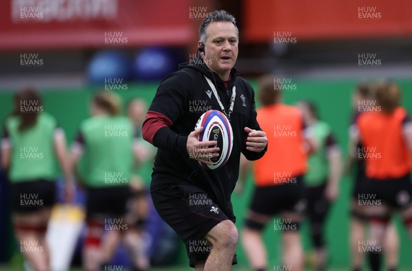 250324 - Wales Women Rugby Training Session  - Shaun Connor, Wales Women attack coach, during training session ahead of the Guinness Women’s 6 Nations match against England