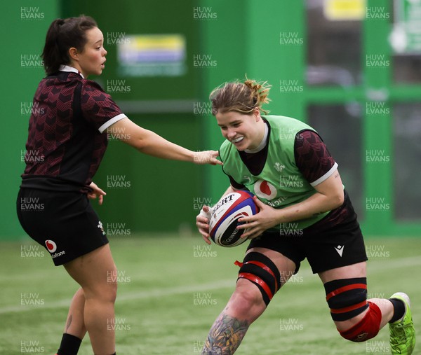 250324 - Wales Women Rugby Training Session  - Bethan Lewis and Meg Davies during training session ahead of the Guinness Women’s 6 Nations match against England