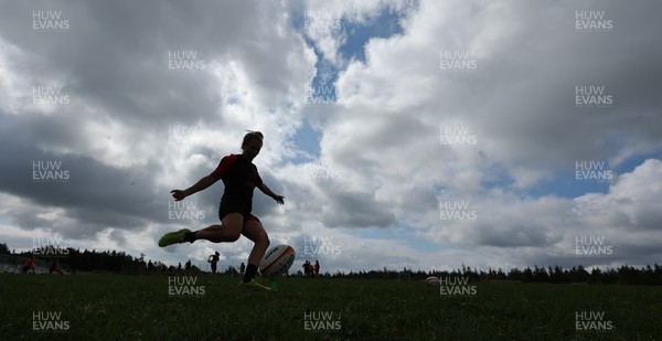 250822 - Wales Women Rugby Training Session - Elinor Snowsill goes through kicking practice during a training session ahead of the match against Canada