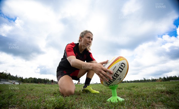 250822 - Wales Women Rugby Training Session - Elinor Snowsill goes through kicking practice during a training session ahead of the match against Canada